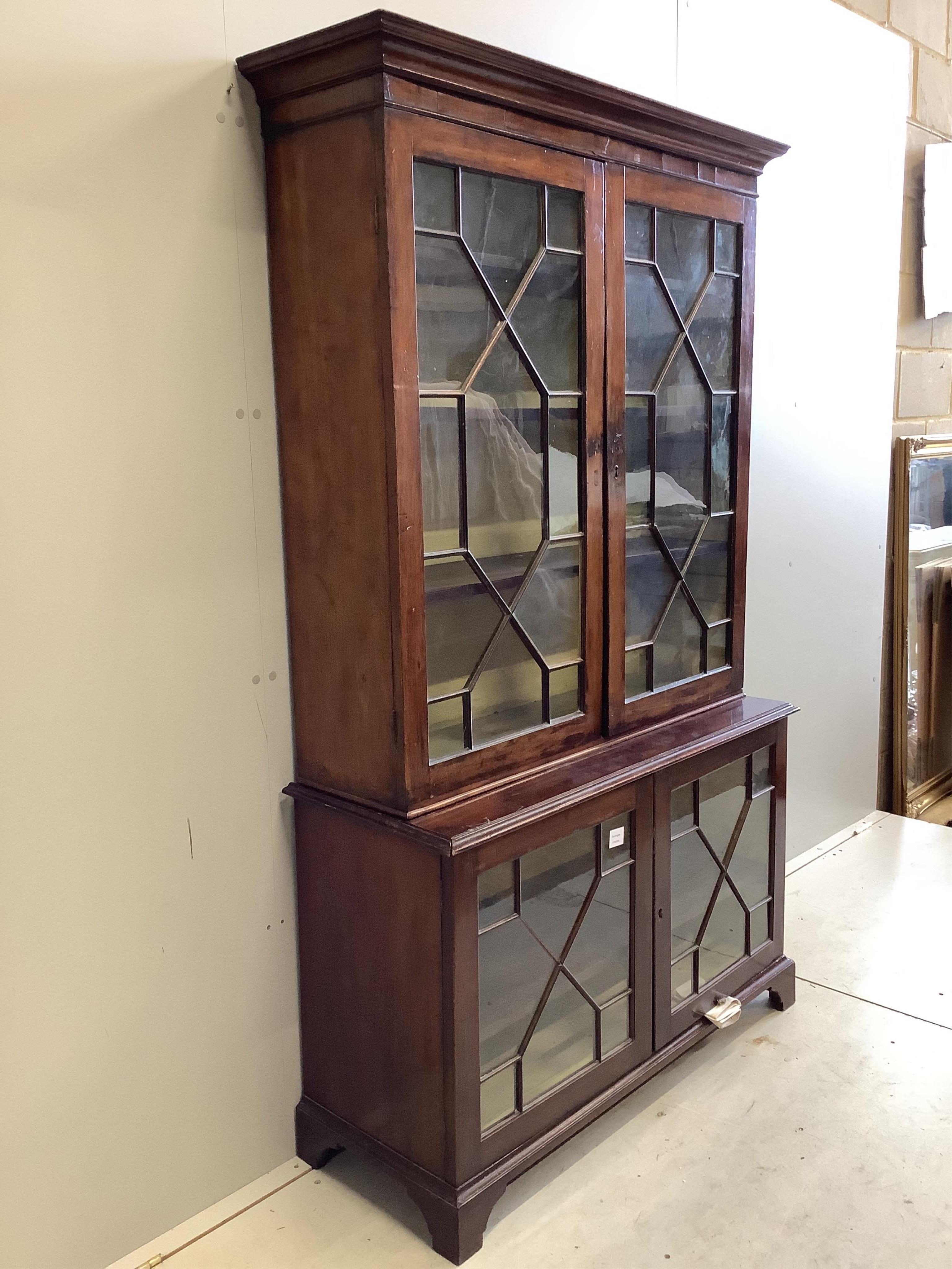 A George III style mahogany bookcase, width 112cm, depth 32cm, height 184cm. Condition - poor to fair